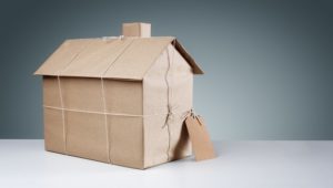 35905328 - new house wrapped in brown paper concept for real estate, buying a new home, construction or moving house